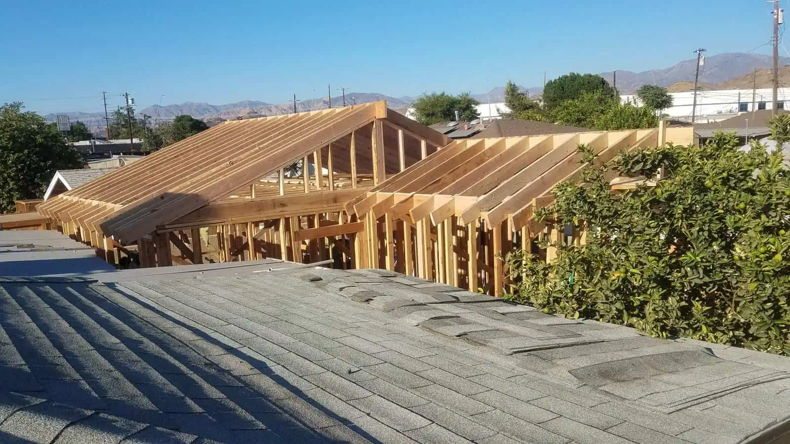 Wooden roof framing under construction for a new building project.